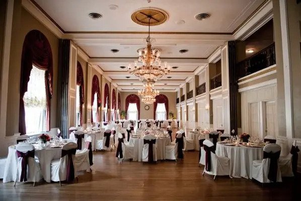 A large ballroom with tables and chairs set up for a wedding, perfect for hosting Pennsylvania bridal shows.