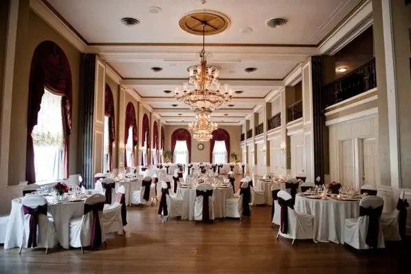 A large ballroom with tables and chairs set up for a wedding, perfect for hosting Pennsylvania bridal shows.