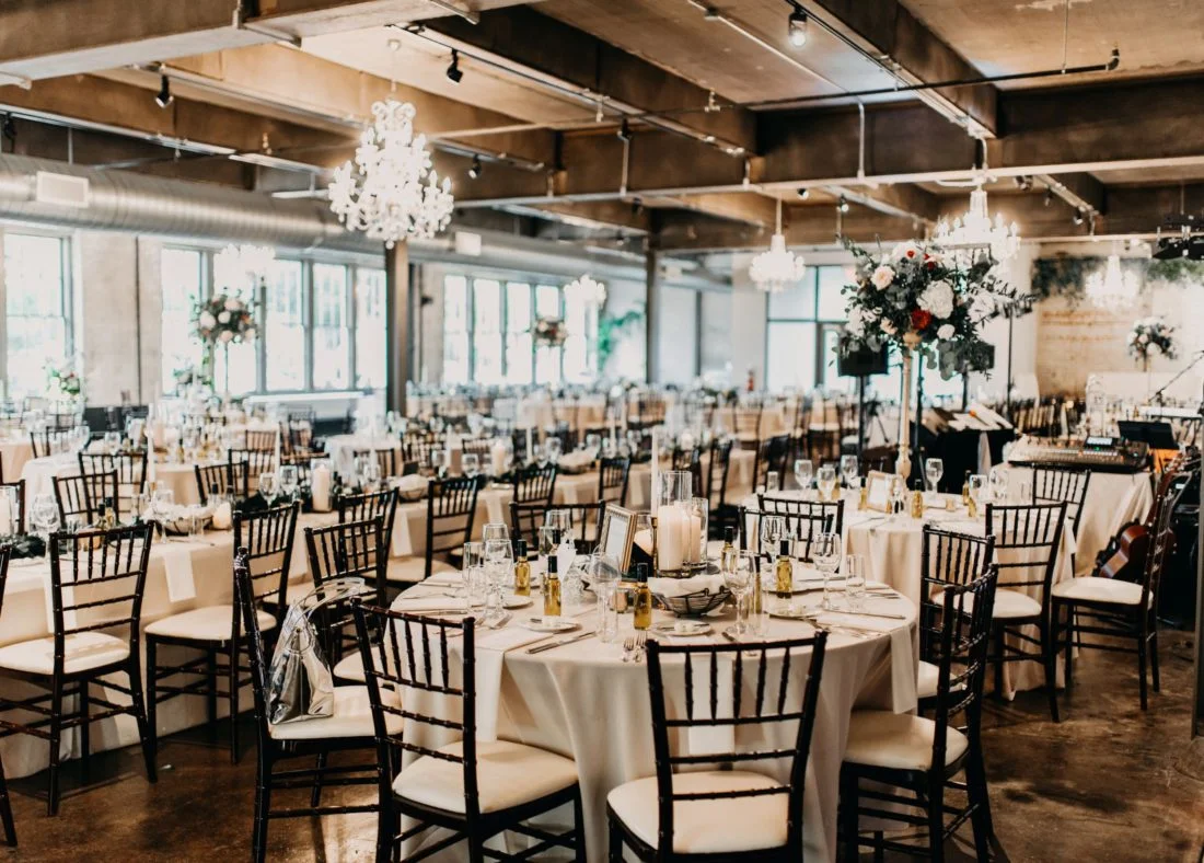 A wedding reception set up in an industrial space, showcased at a Pennsylvania wedding expo.